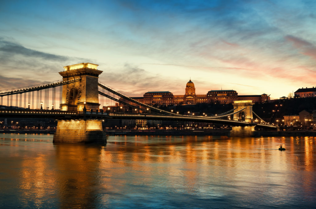 Hungarian landmarks, Chain Bridge, Royal Palace and Danube river in Budapest at night.