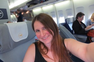 a woman taking a selfie in an airplane