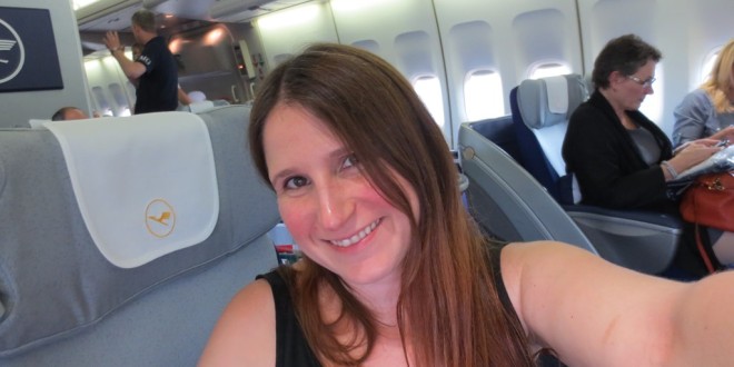 a woman taking a selfie in an airplane