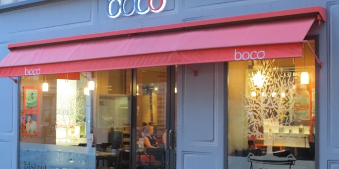 a store front with a red awning