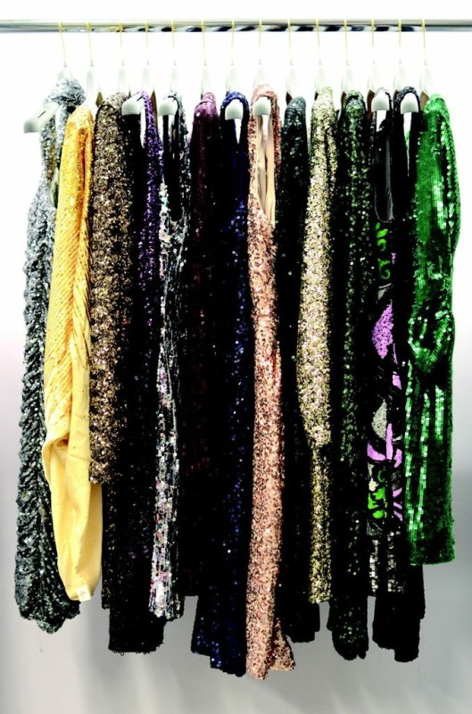 a group of sequins on a rack