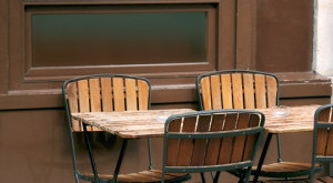 a table and chairs outside a building