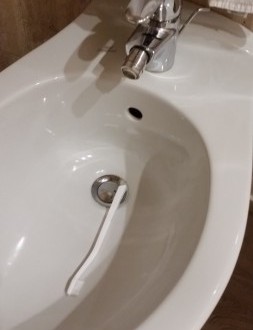 a toothbrush in a toilet