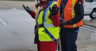 a woman in a safety vest and a man in a vest