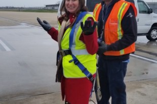 a woman in a safety vest and a man in a vest