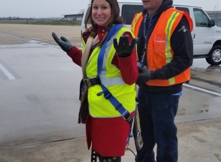 a woman in a safety vest and a man in a vest
