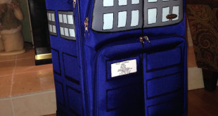 a blue suitcase with a police box on it