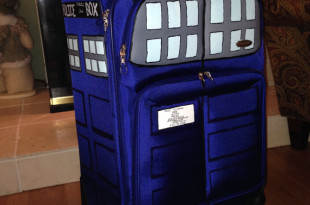 a blue suitcase with a police box on it