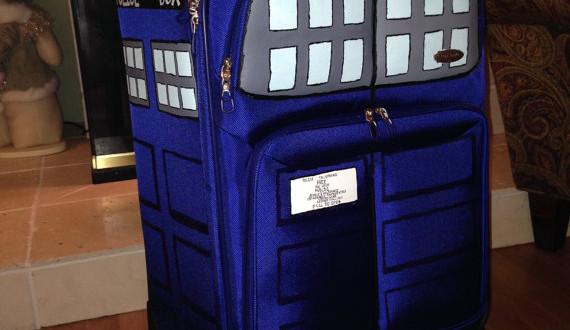 a blue suitcase with a police box on it
