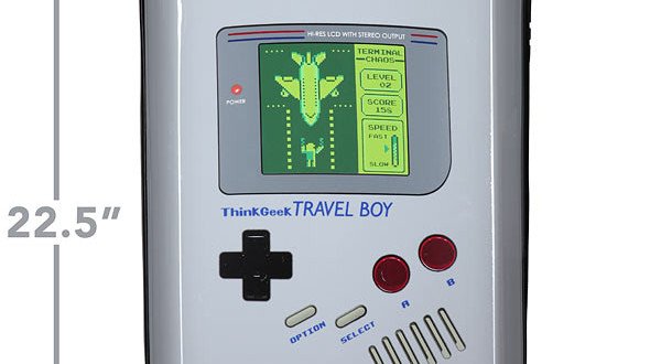 a suitcase with a screen and a game controller