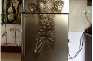 a silver refrigerator with a human figure on it