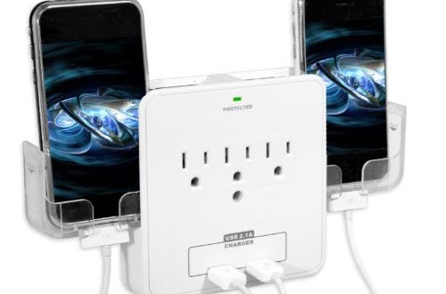 a white electrical outlet with two phones