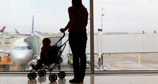 a woman with a baby in a stroller