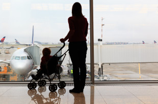 a woman with a baby in a stroller