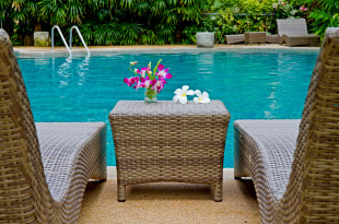 a table next to a pool