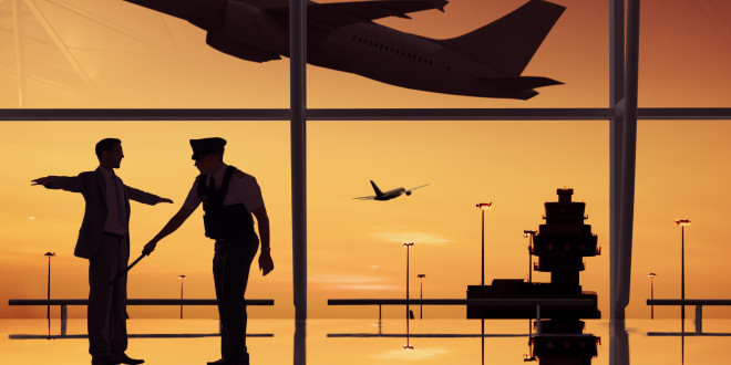 a silhouette of two men in an airport