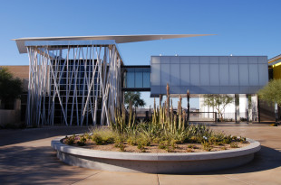 a building with a planter in front of it