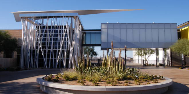 a building with a planter in front of it