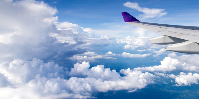 an airplane wing in the sky