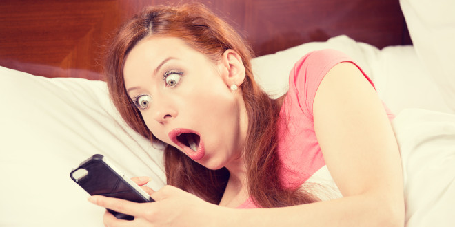 a woman looking at a phone