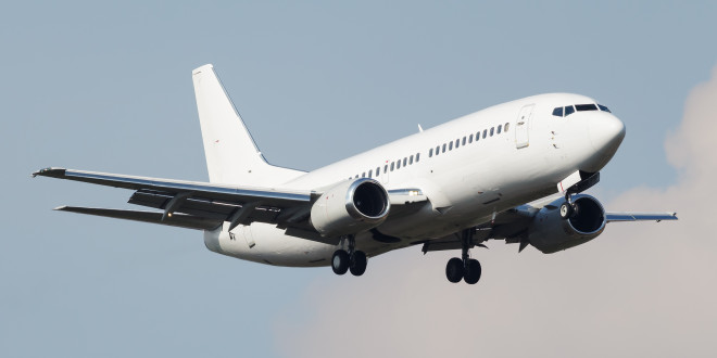 a white airplane in the sky