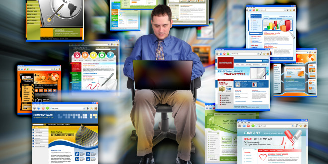 a man sitting in a chair with a laptop