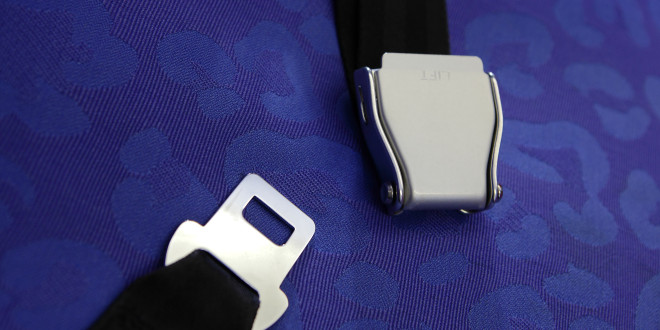 a seat belt on a blue surface
