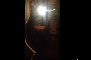 a blurry image of a light in a dark room