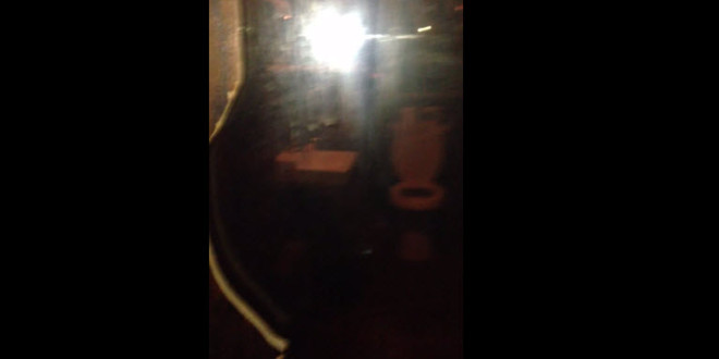 a blurry image of a light in a dark room