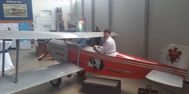 a man sitting in a small airplane