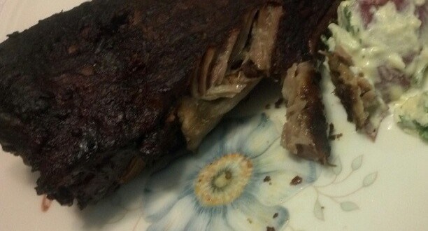 a plate of meat and salad