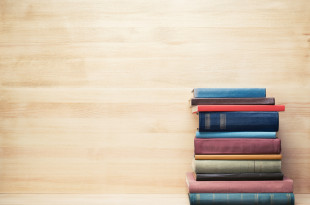 a stack of books on a shelf