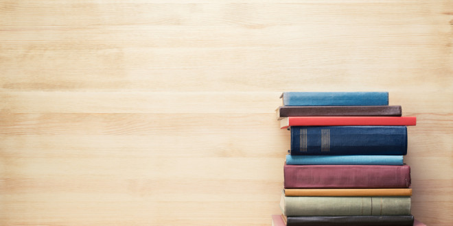 a stack of books on a shelf