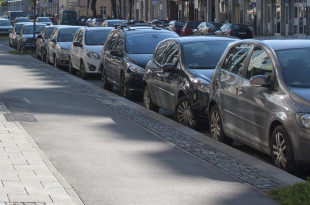 a row of cars parked on a street