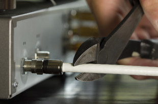 a person cutting a cable