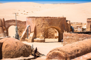 a desert landscape with a round structure