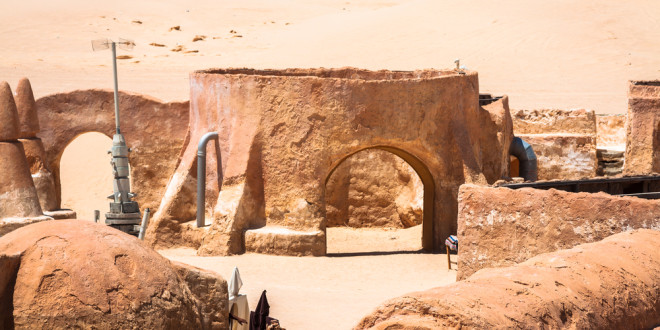 a desert landscape with a round structure