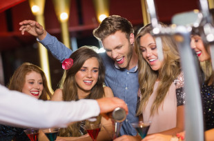 a group of people at a bar