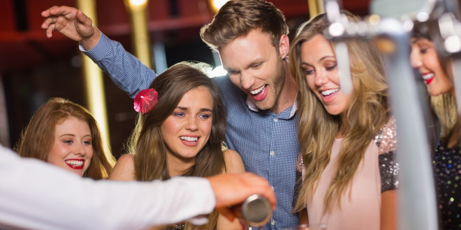 a group of people at a bar