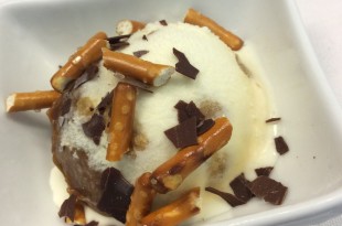 a bowl of ice cream with pretzels and chocolate chips