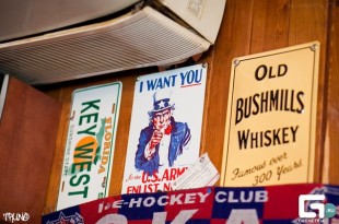 a wall with signs and air conditioner