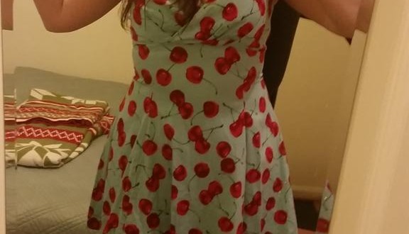 a woman taking a selfie in a mirror