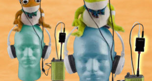 a group of stuffed animals on top of a headphone