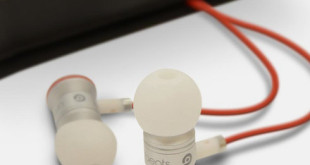 a pair of earbuds with a red cord