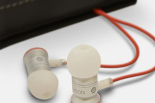 a pair of earbuds with a red cord