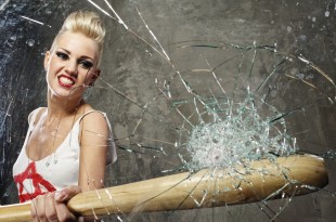 a woman holding a baseball bat