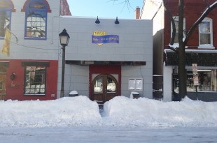 a building with snow on the ground