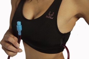 a woman holding a tube with a blood sample