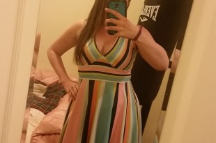 a woman taking a selfie in a mirror