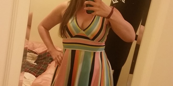 a woman taking a selfie in a mirror